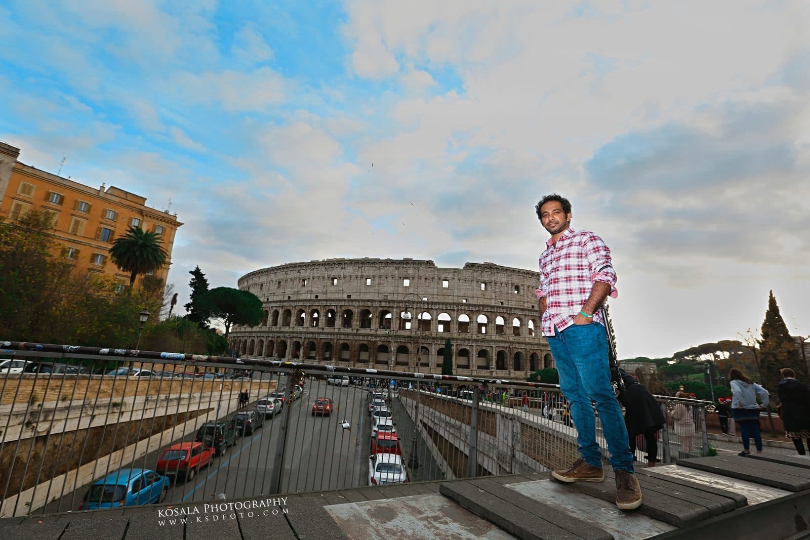 Ramesh at a street overlook near the Colosseum